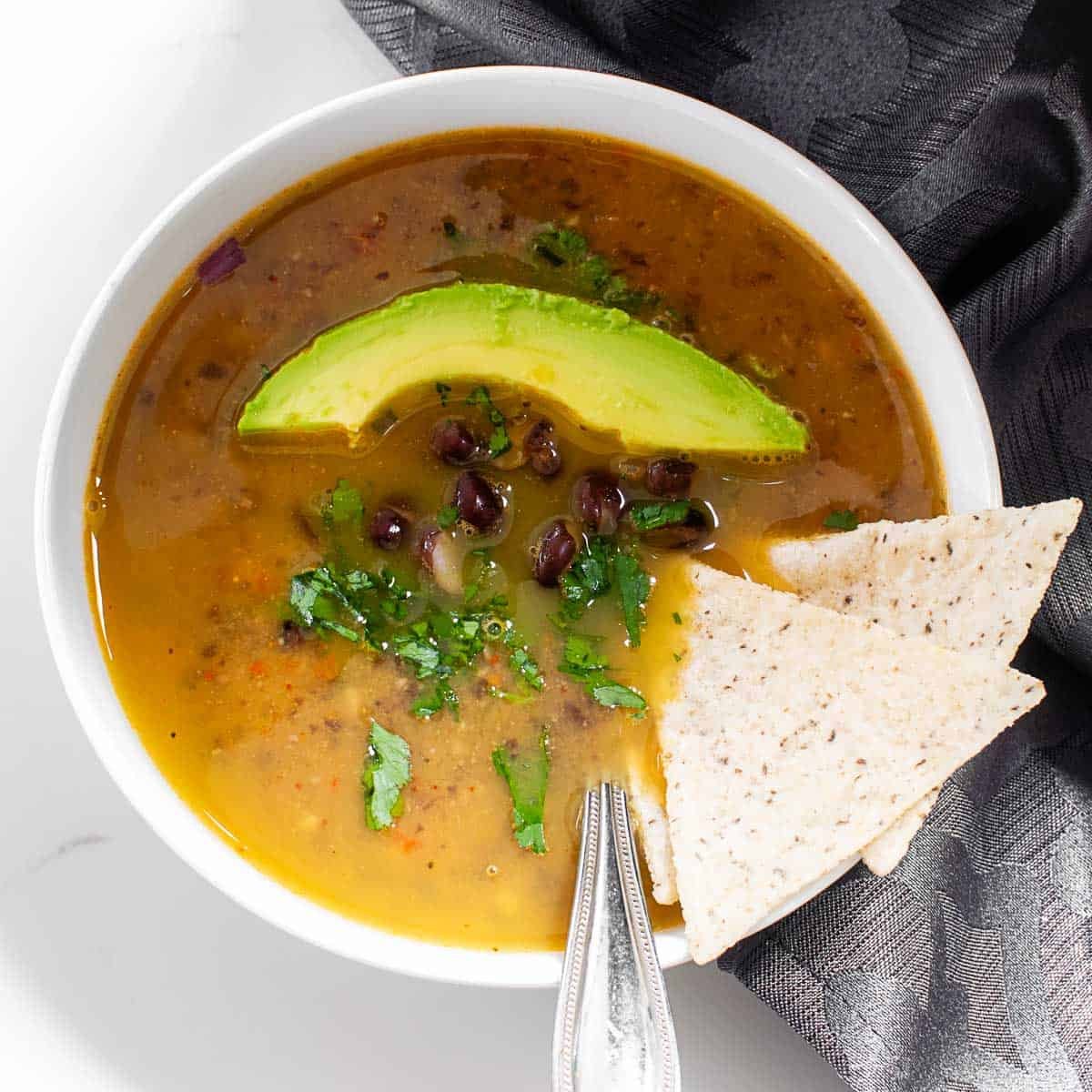 top view of garnished and served black bean soup.