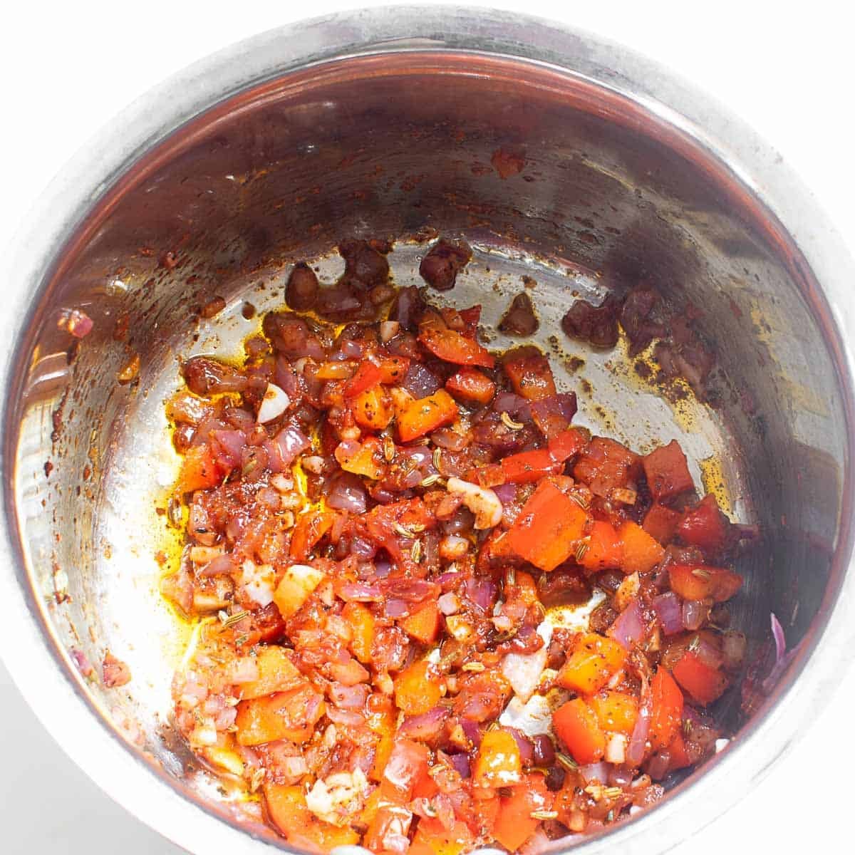 seasonings and spices added to the same cooking pot with other ingredients.