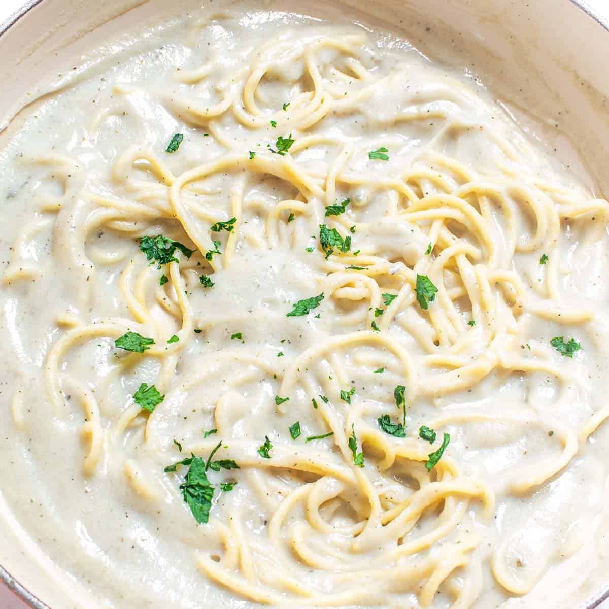top view of cooked cauliflower alfredo sauce pasta in the pan. 