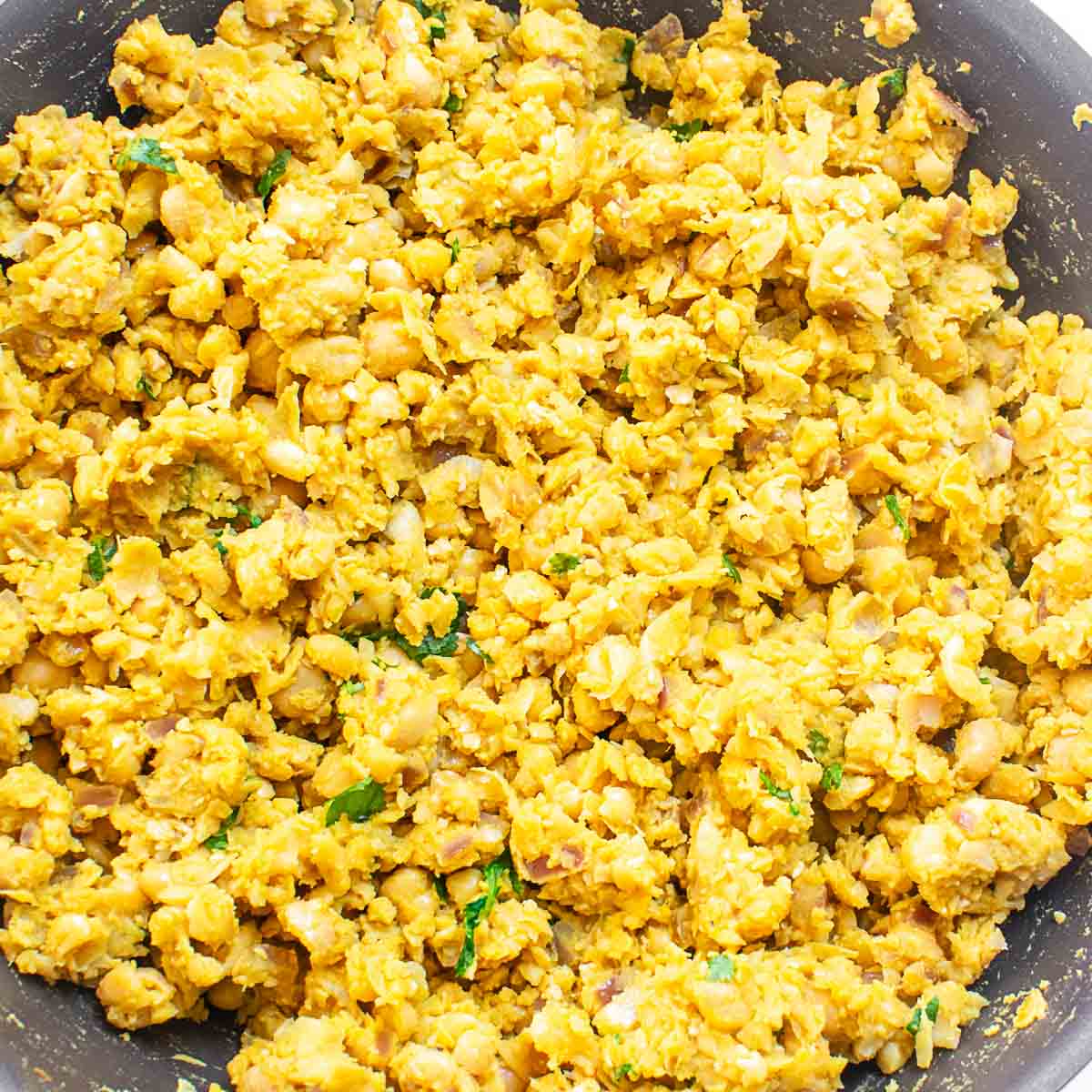 cooked chickpea scramble in the pan ready to be served. 