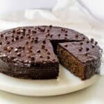 a slice of buckwheat cake being take out from the from pie.