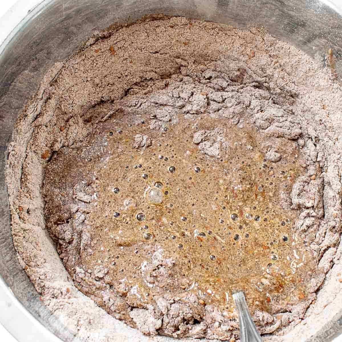 wet ingredients folded into the dry ingredients in the mixing bowl. 